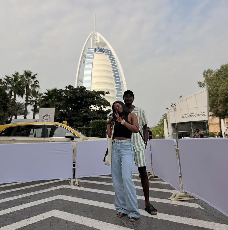 Two travellers posing at the Burj Al Arab welcome centre