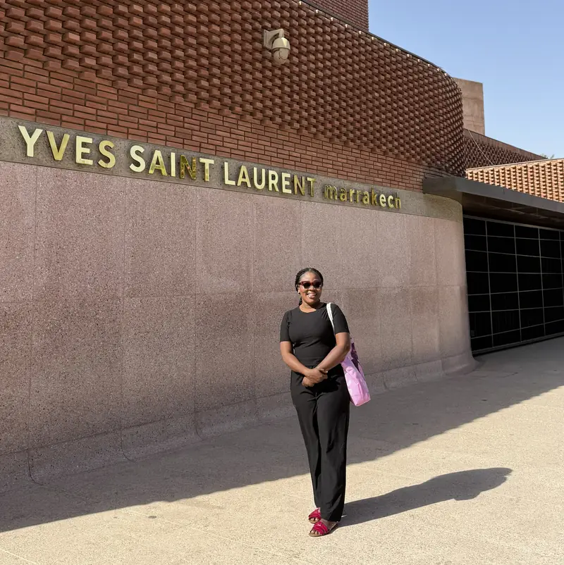 A traveller in black outside the Yves Saint Laurent Museum in Marrakech